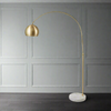 Tall, brass arc floor lamp on a heavy round marble base, a typical deco style floor lamp in a brushed gilt metal.&nbsp; To get the greatest effect, place the base in a corner and allow the arc to throw light across the room.