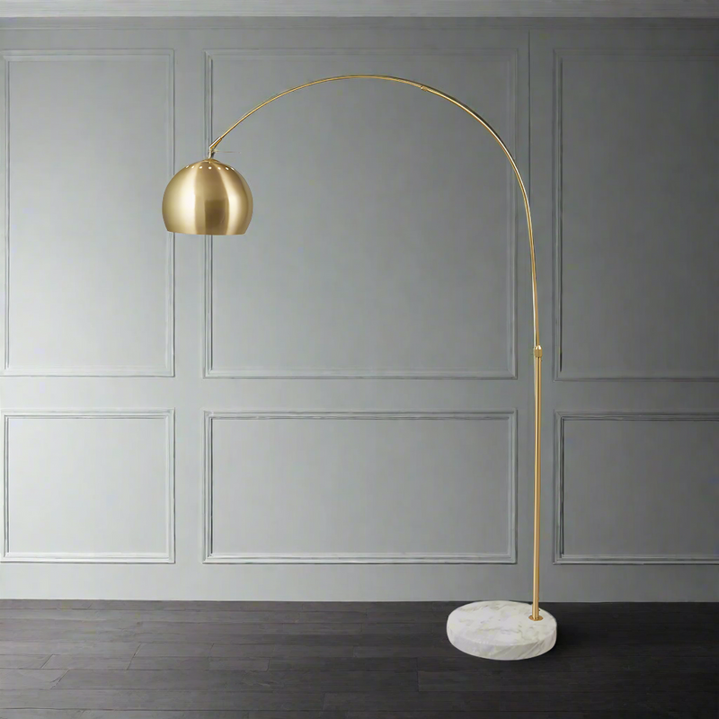 Tall, brass arc floor lamp on a heavy round marble base, a typical deco style floor lamp in a brushed gilt metal.&nbsp; To get the greatest effect, place the base in a corner and allow the arc to throw light across the room.