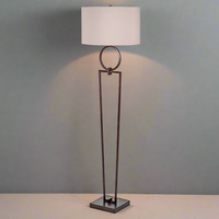 Tall bronze metal floor lamp, with a metal circle decoration to the top, with a round natural fabric shade.&nbsp; A classic living room floor light, striking and elegant.