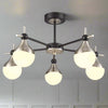 A five light nickel and opaque glass globe light, semi-flush on a back and nickel fixture, stunning mix of colours, for both contemporary and classic settings.&nbsp; A perfect sitting room light and great in any room with a lower ceiling height.&nbsp; These work well in an office or library, small bedroom, perfect over a dining table

H: 29 cm&nbsp; &nbsp;W: 52 cm&nbsp;