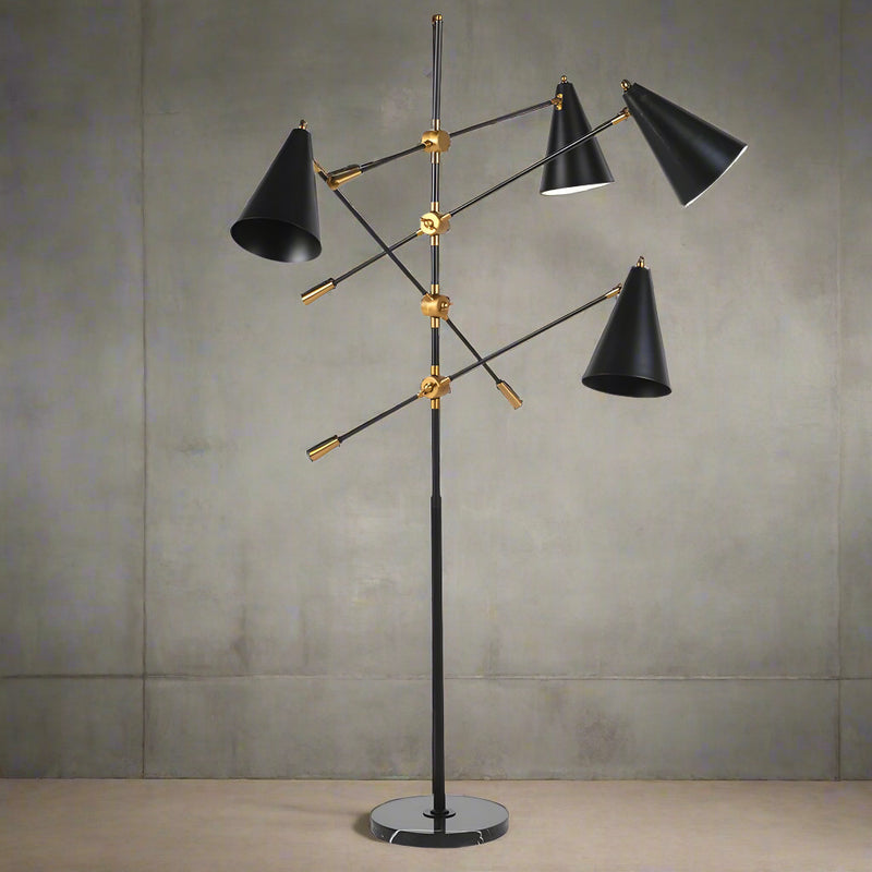 A stunning contemporary floor lamp with four black adjustable, directional lampshades coming from a tall black lamp frame on a marble base.&nbsp; &nbsp;The shades are attached to the frame with a gilt adjustable screw.&nbsp; &nbsp;Contemporary floor lamp with an industrial twist.&nbsp; The directional shades can be used to light up every area of the room, stood by the side of a favourite chair for reading.&nbsp;&nbsp;