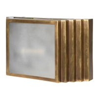 A brass wall light in the shape of a stepped brushed brass box, with a frosted front.&nbsp; The overall effect of this stunning wall light is of the 'art deco' period, the box construction with the frosted glass detail to the front.&nbsp; The lamp can be hung vertically or horizontally and will exude a beautiful muted light. Two of these on your wall will create a dramatic, stylish effect.