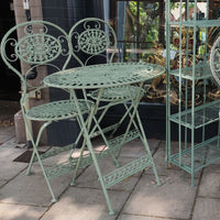 Green iron garden furniture table and two chairs, fully folding for easy winter storage. The set is the perfect size for a smaller garden and perfect for a patio or balcony