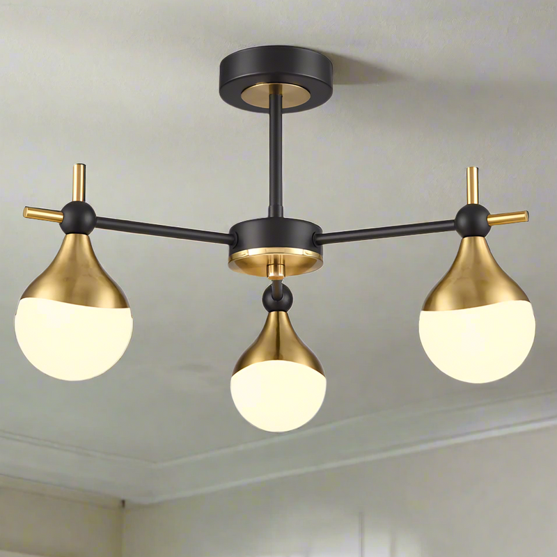 A three brushed gold and opaque glass globe light.&nbsp; Semi-flush on a back and gold metal fixture creating stunning mix of colours for both contemporary and classic settings. This stylish semi-flush pendant would look amazing in a bedroom, hall over a dining table. The mixture of colours is perfect.