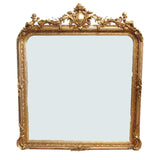 Tall, very ornate giltwood mirror, in a period style with ornate beaded edge. Crested with ornate flourishes to the top - exceptionally decorative overmantle shaped mirror.