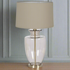 A glass urn shaped base on a gilt metal base with a taupe linen shade, stunningly elegant lamp, a statement lamp, suitable for any space, a sophisticated high end look.&nbsp;


H: 74 cm W: 43 cm