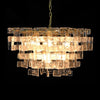 A statement chandelier made up of textured glass links resembling thick frosted crystal.&nbsp; &nbsp;The links are laid out in an overlapping layers, supported on a meal frame of antique gold providing a warm contrast to the cool, clear glass.&nbsp; Suspended on a chunky chain from a metal ceiling rose, the chandelier requires E14 bulb to give the radiant, ambient glow.&nbsp; Ideal for a foyer, living room or dining room .

H:&nbsp; 50 cm W: 75 cm&nbsp; D 75 cm&nbsp;