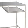 This sleek and minimalist glass desk with clean silver metal lines is generous in size but gives the illusion of space with it's clear glass top and shelves.&nbsp; A durable grey tinted tempered glass top with two open shelves make this an ideal piece for anyone looking for a clutter free stylish workspace.&nbsp;

H: 76 cm W: 130 cm D: 50 cm