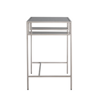 This sleek and minimalist glass desk with clean silver metal lines is generous in size but gives the illusion of space with it's clear glass top and shelves.&nbsp; A durable grey tinted tempered glass top with two open shelves make this an ideal piece for anyone looking for a clutter free stylish workspace.&nbsp;

H: 76 cm W: 130 cm D: 50 cm