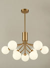 A stunning statement light that diffuses ample light around your home.&nbsp; Nine opaque glass shades are suspended from beautiful brushed brass metal arms that are seamlessly attached to an adjustable or extendable brass rod.   Maximum drop: 135 cm&nbsp; Minimum drop: 45 cm&nbsp; Diameter: 70cm  Requires 9 x G9 bulbs not included.&nbsp; Please select from our light bulb section.