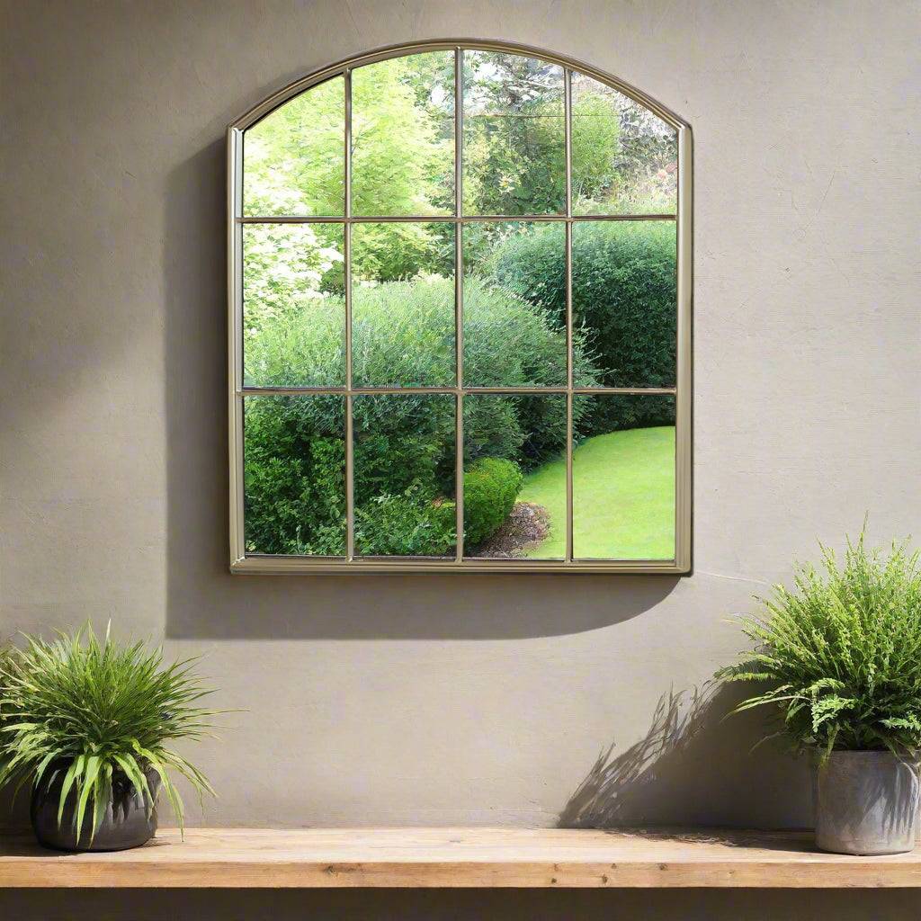 Brushed gold arched metal window mirror. 12 panel mirror. Perfect wall window mirror for your garden or any outdoor space adding some glamour.
