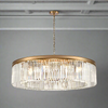 Gold metal rimmed crystal prism chandelier.&nbsp; Very high quality crystal prism drops suspended from a brushed gold finish metal surround. A massive light with a massive impact !! This is the fixture you need to add ultimate luxury to your home.