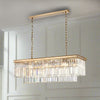 Exceptionally stunning rectangular crystal prism chandelier. The warmth of the gold metal with the crystal prism drops - total luxury. Perfect over a dining table, totally luxurious. 