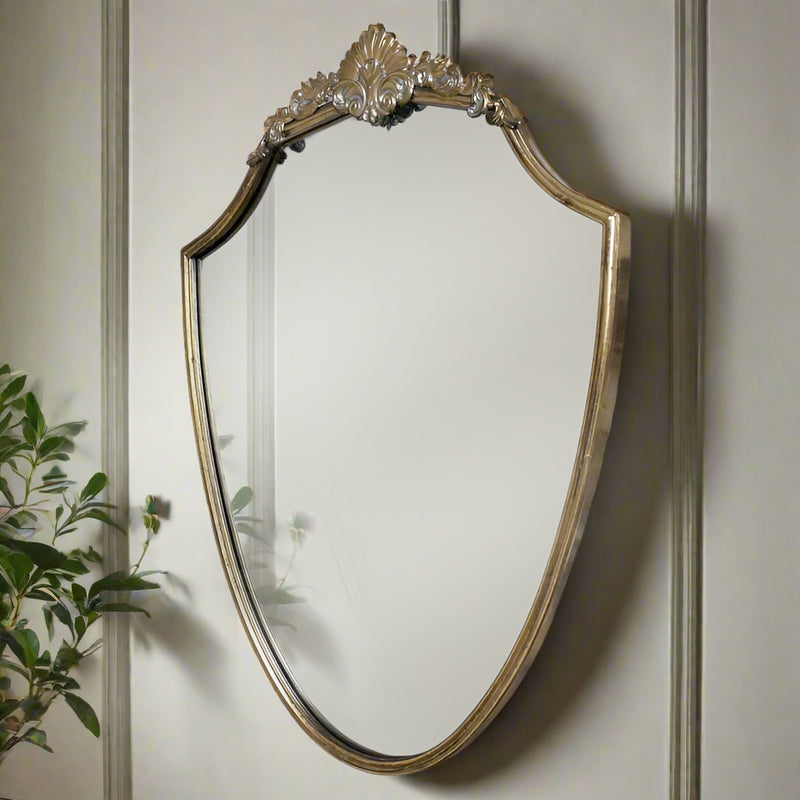 Exceptional oval mirror, ornate with a carved frame and flourishes to the top and base, great vintage looking mirror in brass. A classic shape perfect for a period home.