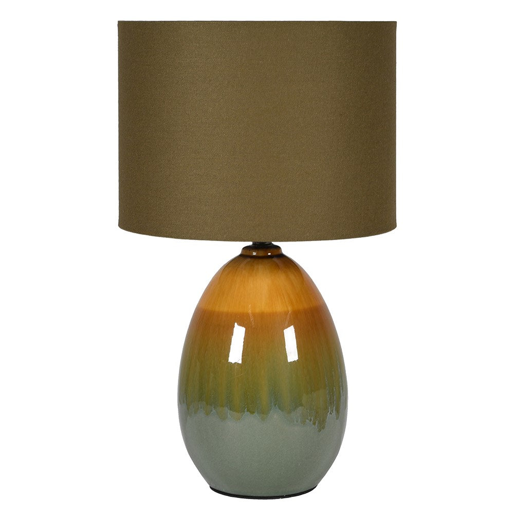 A ceramic lamp in varying shades of green and brown in an ombre design climbing in the base.