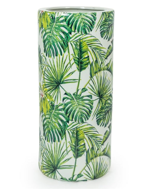 An exuberant umbrella stand wuth tropical leaves in a vivid green colour.  H: 47 cm W: 21 cm D: 21 cm