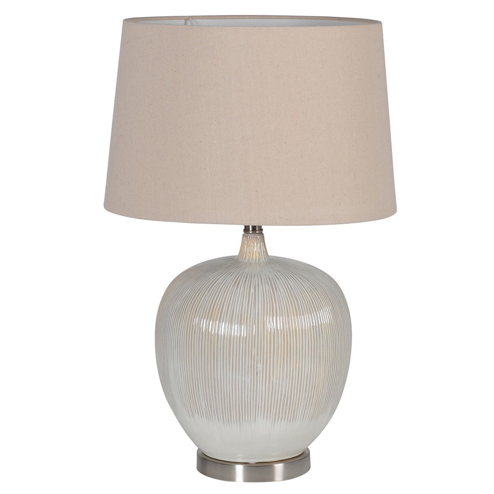 Such a great lamp, the shade perfectly matching the colour of the ceramic base. This lamp is really about textures, the linen shade and the ceramic base - perfect.