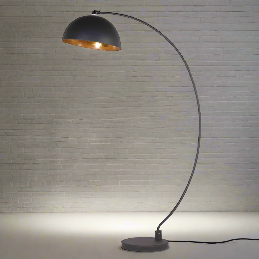 Large black arc lamp with a black shade lined with gold, an exceptional look, with a wide arc.&nbsp; Throws a perfect gold glow into your room. This arc lamp definitely crosses the divide between Industrial a glamour, with the benefit of the shape and the gilt inner to the shade it can work so well in both interiors. 