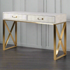 Stunning ivory faux shagreen table which makes a perfect dressing table or glamorous desk with two useful draws. &nbsp; Gold cross metal legs are on the sides leaving plenty of room for you to add a chair or stool. 