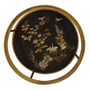 Close-up view of the lacquered lower shelf on the side table, showcasing intricate Japanese-style artwork with cranes, cherry blossoms, and foliage in gold and black tones.