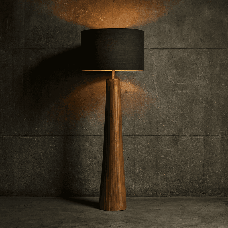 This floor lamp features a finely crafted textured bronze base. The surface is subtly ridged with organic vertical striations, giving it a hand-finished, artisanal look