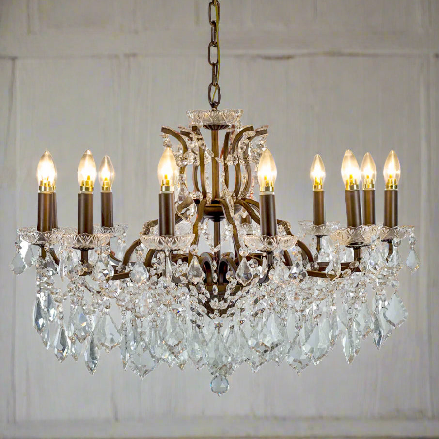 Traditional bronze twelve light chandelier for dining rooms, hallways and period or modern interiors