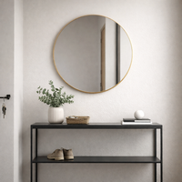 The slim gilt frame on this mirror just accentuates the beauty of large glass, a lot of mirror in a simple, elegant, round frame.  This mirror suits any room and will add light, from every direction to any room.
