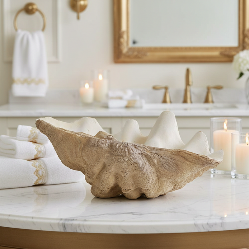Large decorative shell bowl used for bathroom storage
