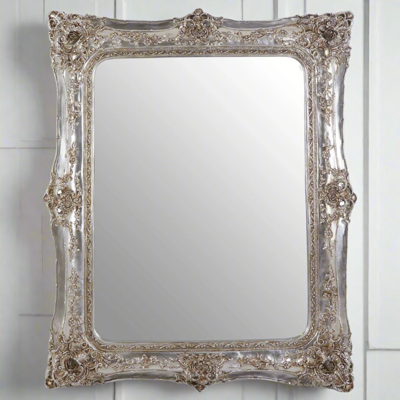 Tall, highly decorative champagne mirror. A statement mirror with its luxurious design and ornate detailing.&nbsp; A double skinne frame for extra drama. A real tatment mirror, suitable for a hallway, living room and even a glamourous bedroom/dressing room.


H: 164 cm W: 135 cm