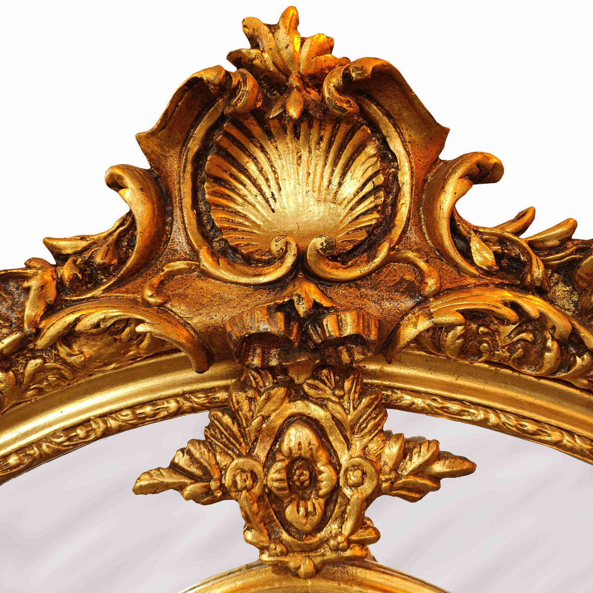 Ornate gilded mirror frame with cherub accents and intricate floral carvings