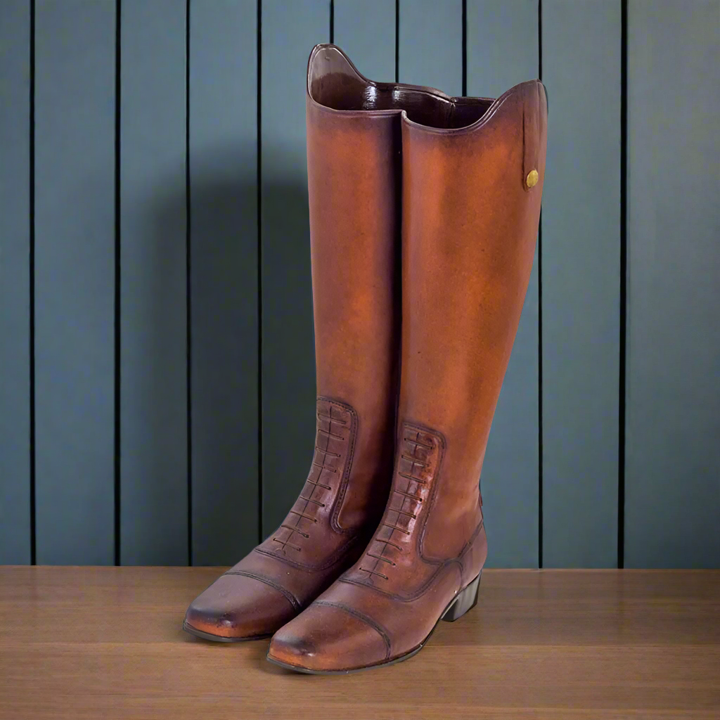 An umbrella stand with a design offering a vintage or quirky look for a hallway. This could serve both an aesthetic and practical function, keeping umbrellas neatly stored while also adding an interesting element of design to the space.
The boots imitates the look of a rich, brown leather with a glossy finish, which make them look sophisticated and stylish. You could pair them with wooden furniture, woven baskets, and other earthy tones to create a cozy, welcoming hallway, giving off a vintage or country-ch