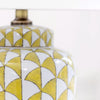 Lemon and white coloured, urn shaped ceramic lamp with a bright white fabric shade. Will brighten any room you place it in, a touch of summer, even in the darkest seasons.&nbsp; The diagonal lemon pattern on a white background has a great contemporary feel, perfect in a modern home and the ceramic finish is a classic for a period home.&nbsp; An ideal lamp for creating a cosy atmosphere combining functionality with a chic design.&nbsp;