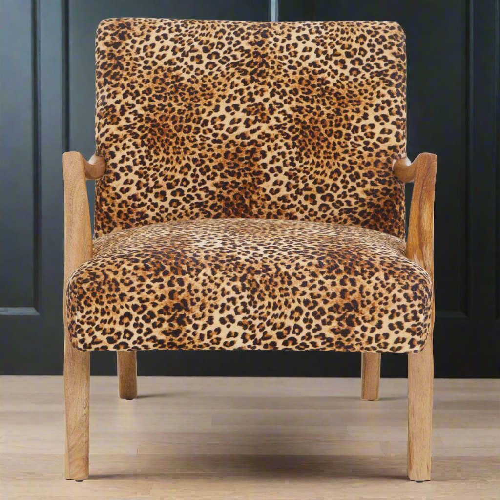Stunning Leopard Print chair with wooden arms and legs. An absolute statement piece wherever this chair is placed, a highlight in your sitting room or bedroom. Decadent animal print always looks so glamorous and this chair is the epitome of vintage glamour.