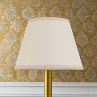 Light cream lamp shade with a classic tapered design, 20cm size, ideal for vintage or traditional lighting décor in home interiors.