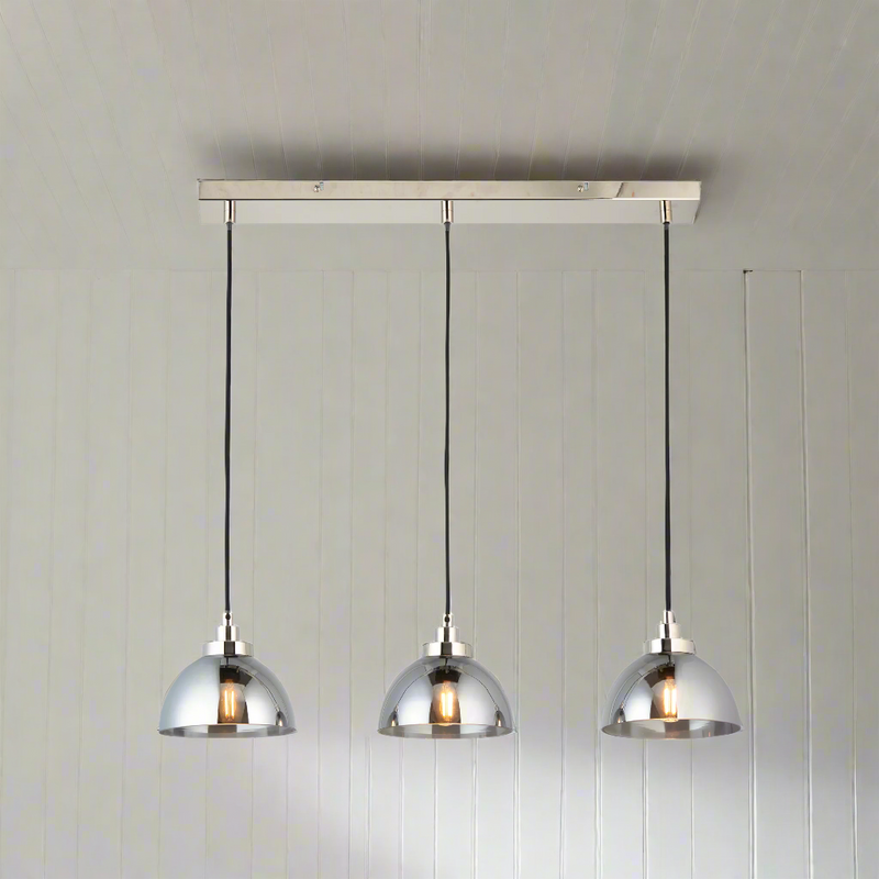 3 light linear pendant, perfect kitchen island or dining table light. Smoked glass pendants on a striking chrome plate with chrome accents. Such an easy way to add a touch of luxury and interest to your room.