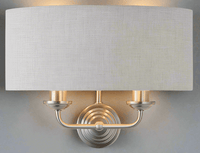 A natural linen half moon shade wall light with twin brushed chrome arms. This light emits a soft warm light perfect for a living, hallway, or bedroom space.
