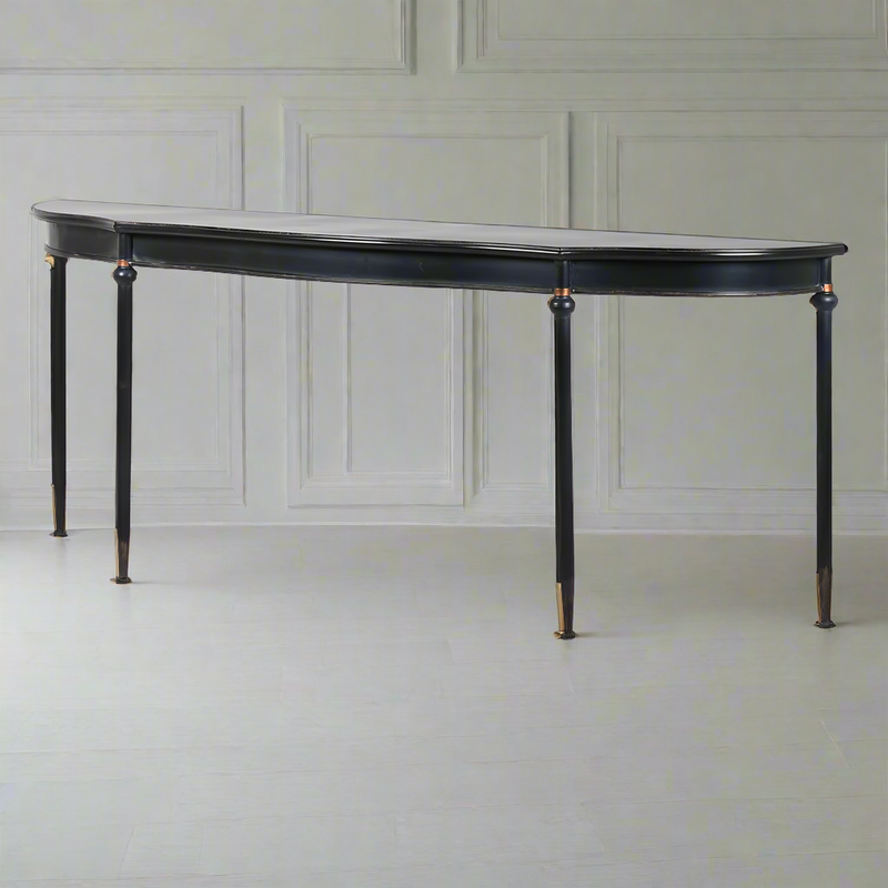 Exceptionally long, black, curved console table, The curved wooden top on four slender legs, turned at the top with a gilt band. A modern take on a Georgian table. A great table for a country house or a period house in the city.