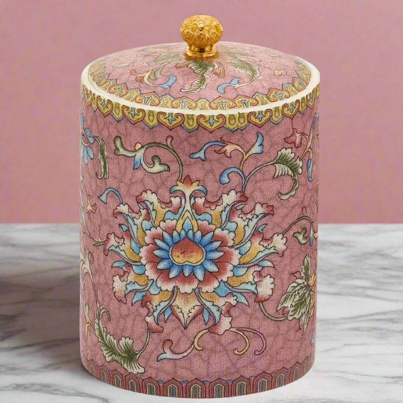 Handcrafted ceramic candle jar with ornate floral details and gold accents, scented with Mandarin and Matcha.