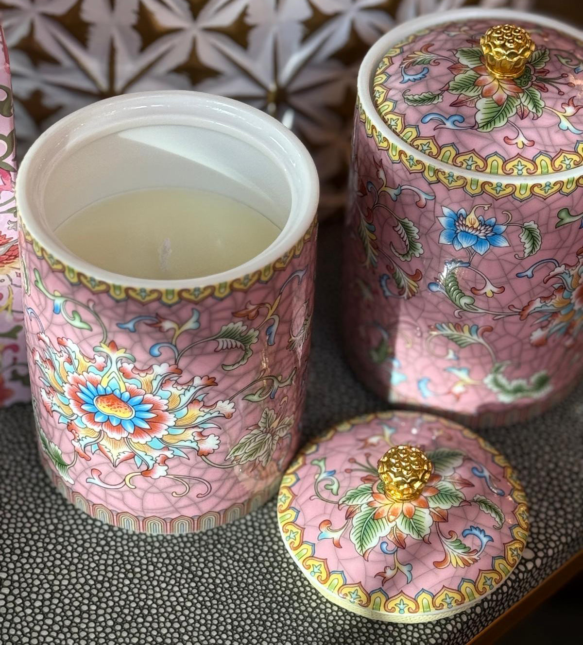 Handcrafted ceramic candle jar with ornate floral details and gold accents, scented with Mandarin and Matcha.