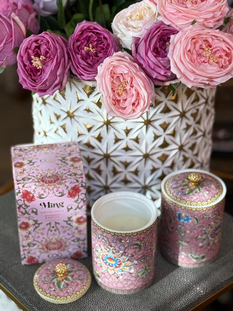Handcrafted ceramic candle jar with ornate floral details and gold accents, scented with Mandarin and Matcha.