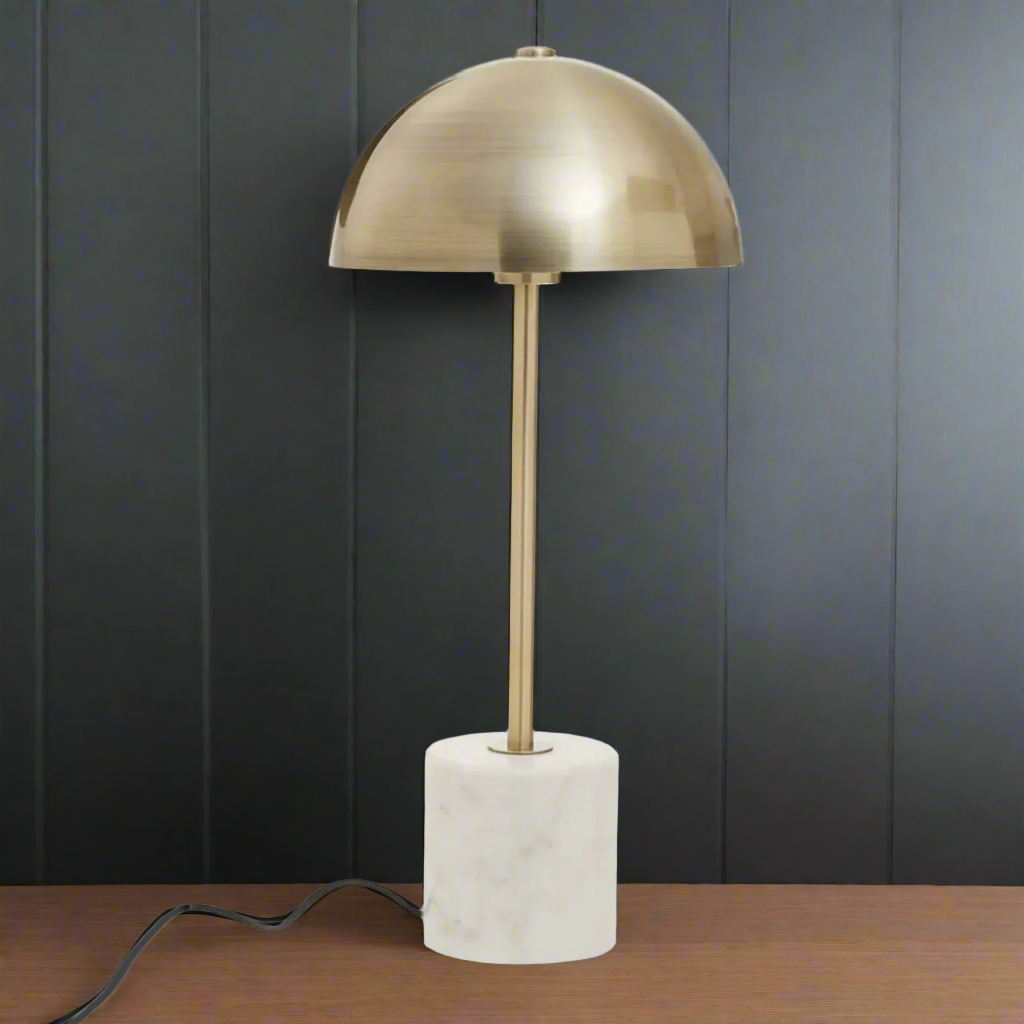 A uniquely different sleek gold table lamp with a marble base.&nbsp; Light shines down and spreads throughout giving a warm glow to your space.&nbsp; This lamp can be used as a desk lamp, or on a console table to add style and illumination to a hall or living room.