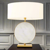 This lamp is total luxury, a large round white marble disc bound in gilt metal set off by a perfectly matched white oval shade.&nbsp; Deserving of the most prominent place in your home.