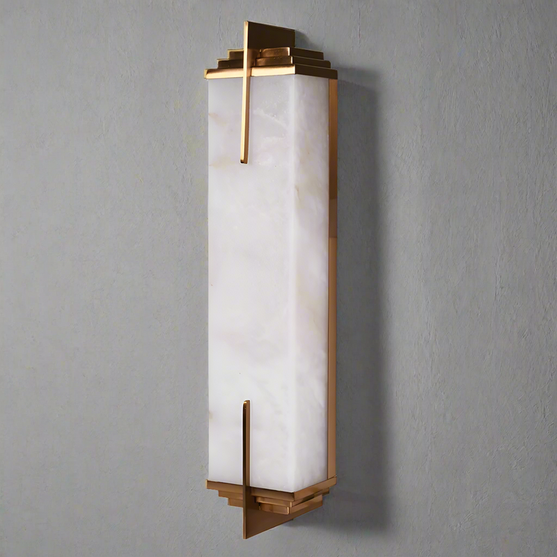 A marble art deco style wall light, the sleek geometric lines of this light has a stunning sophisticated , luxurious feel.&nbsp; Perfect to light up the walls&nbsp; in a living area, alongside a mirror in the hall or even in a bathroom. A discreet and stylish way to add light to your home.

H: 51 cm W: 10 cm D: 9 cm&nbsp;