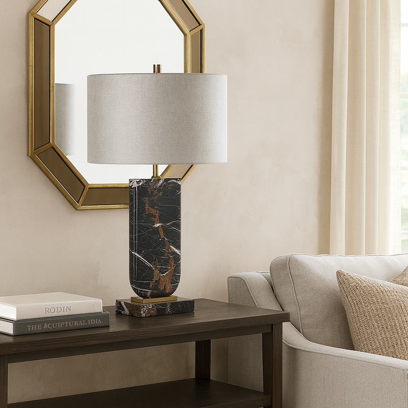 Marble table lamps are so luxurious and this dark veined marble base is no exception, the column of the lamp is set into a rectangular base of marble in the same colour.&nbsp; The column has a brass connector to the top and at the base.&nbsp; The shade is a cool grey colour in a woven textured fabric,&nbsp; giving a soft unstructured appearance.&nbsp; The lamp has a modern luxury aesthetic perfect in a sitting room, bedroom stunning in an office. Luxury lighting.&nbsp;

H: 70 cm&nbsp; W: 43 cm&nbsp; D:&nbsp