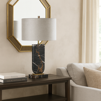Marble table lamps are so luxurious and this dark veined marble base is no exception, the column of the lamp is set into a rectangular base of marble in the same colour.&nbsp; The column has a brass connector to the top and at the base.&nbsp; The shade is a cool grey colour in a woven textured fabric,&nbsp; giving a soft unstructured appearance.&nbsp; The lamp has a modern luxury aesthetic perfect in a sitting room, bedroom stunning in an office. Luxury lighting.&nbsp;

H: 70 cm&nbsp; W: 43 cm&nbsp; D:&nbsp