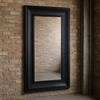 A really chunky framed black wooden mirror in an extra large size.&nbsp; &nbsp;A matte black painted frame, extra large with a sleek modern appearance.&nbsp; The frame has a wood grain feature and a beveled angled profile with a recessed inner border to create a classic elegant look.&nbsp; The mirror is extra large and and can be wall hung or leant against a wall.&nbsp; This is a really substantial mirror and would work well in a space that needs a lot of light, in a living room, hall or bedroom, would look