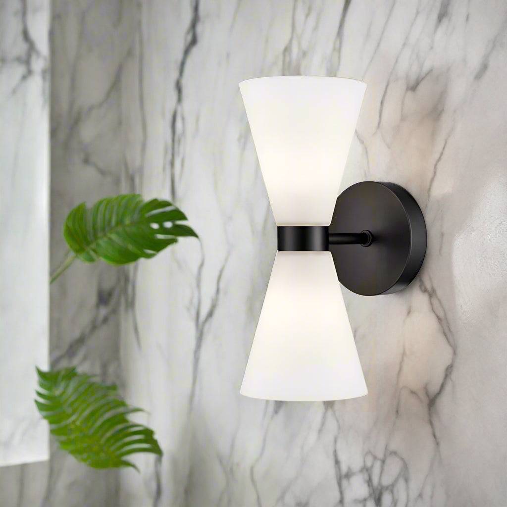 Stylish wall light with matt black metal fixtures and two opal conical glasses It creates an instant classy and elegant feel. IP Rating 44. Bathroom light