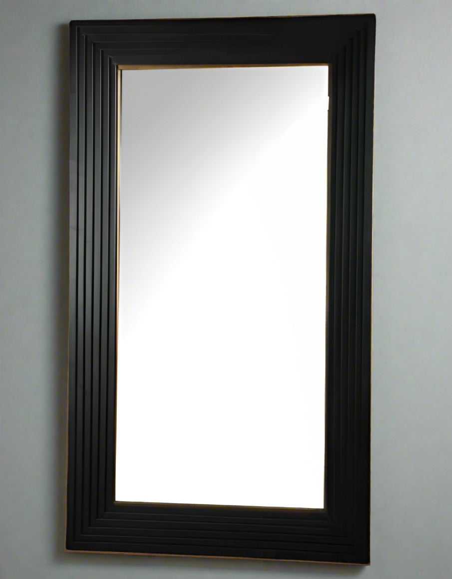 Large black metal&nbsp; framed mirror with a gilt inner to the frame .&nbsp; A particularly large black metal mirror, perfect in an urban or industrial interior, but would not look out of place in a period town home or classic country house. Black&nbsp; mirrors of this size are dramatic and elegant in any room, adding a stylish, contemporary feel.&nbsp; Would work well in any room, large black wooden mirror in the hall to add light and perspective, in a living or dining room for a dramatic effect.