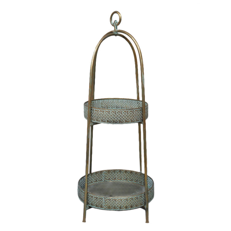 A unique and very pretty shelf unit with pierced metal detailing around the shelves which can be lifted out and also used as trays. ;Finished in a rustic antique gold colour, this metal unit has two shelves encased in an outer frame that can fold flat. 


