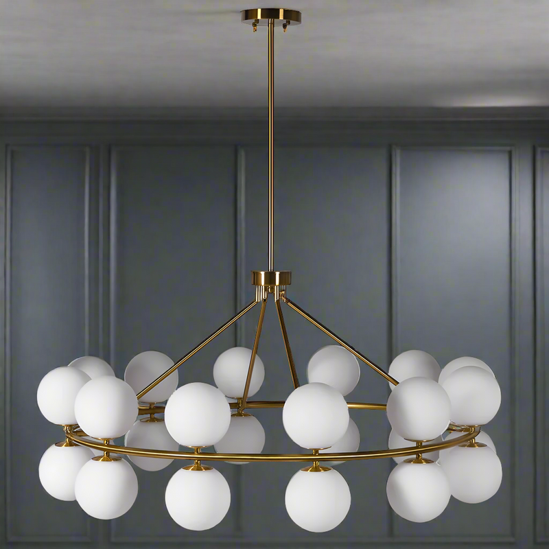 Massive, opaque globe chandelier, 24 globes set around a brushed gold frame, an absolute statement in any room.&nbsp; Lighting is such a fundamental part of any room and this piece sets the tone for your entire home.